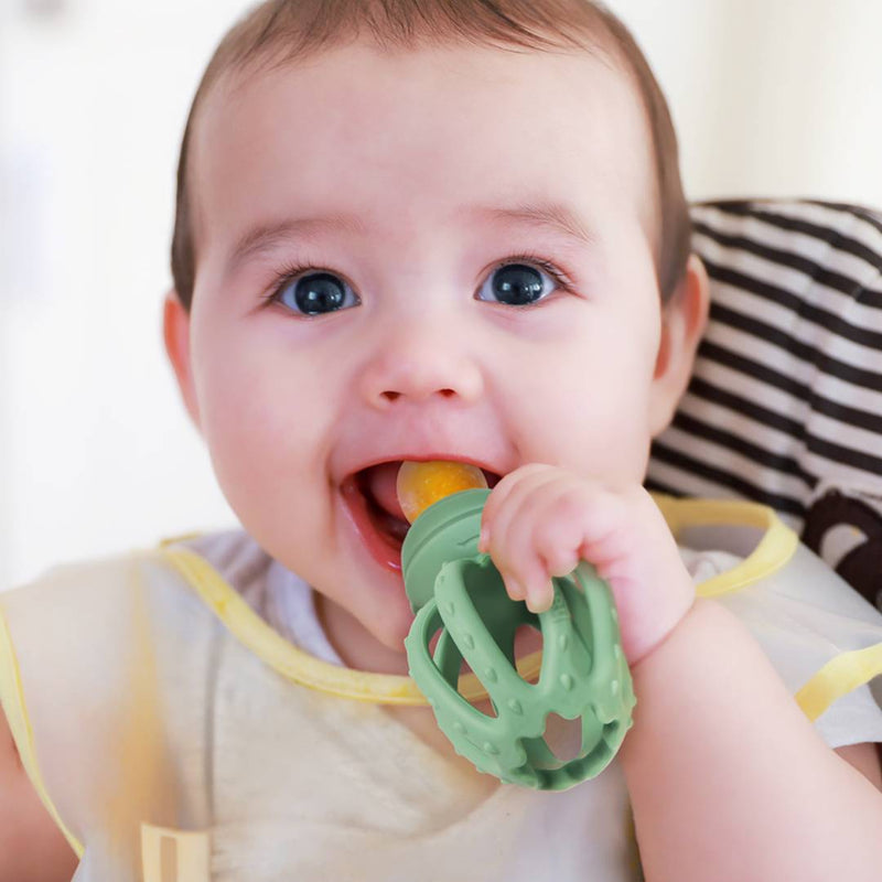 Baby eating solid food using the Haakaa Octopus Fresh Food Feeder